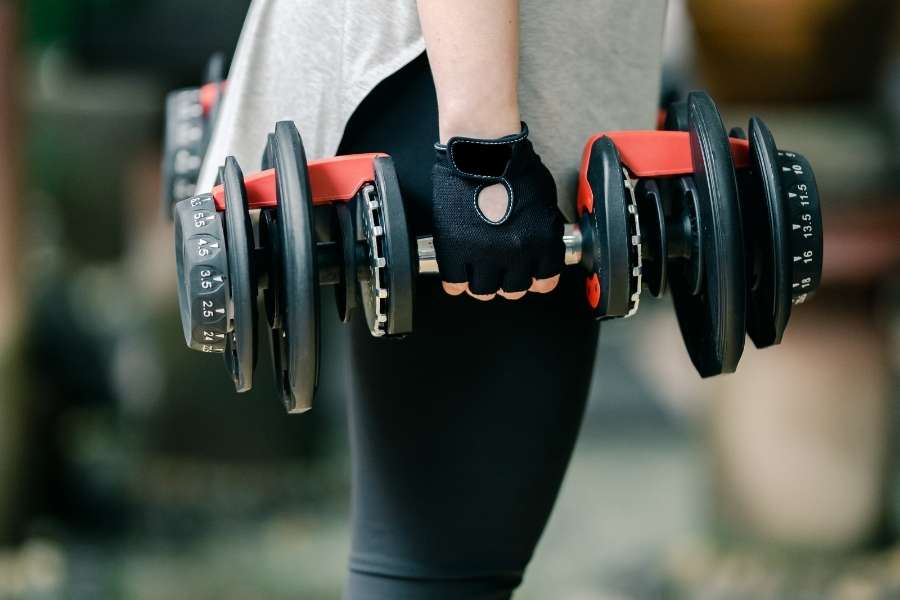 Image of a woman holding dumbbells