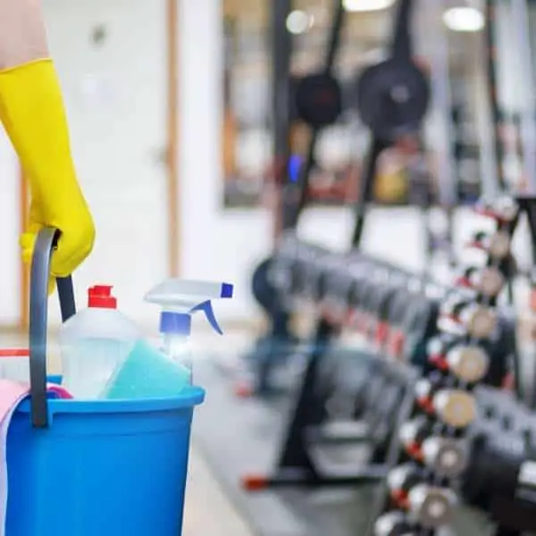 Image of a person cleaning a gym