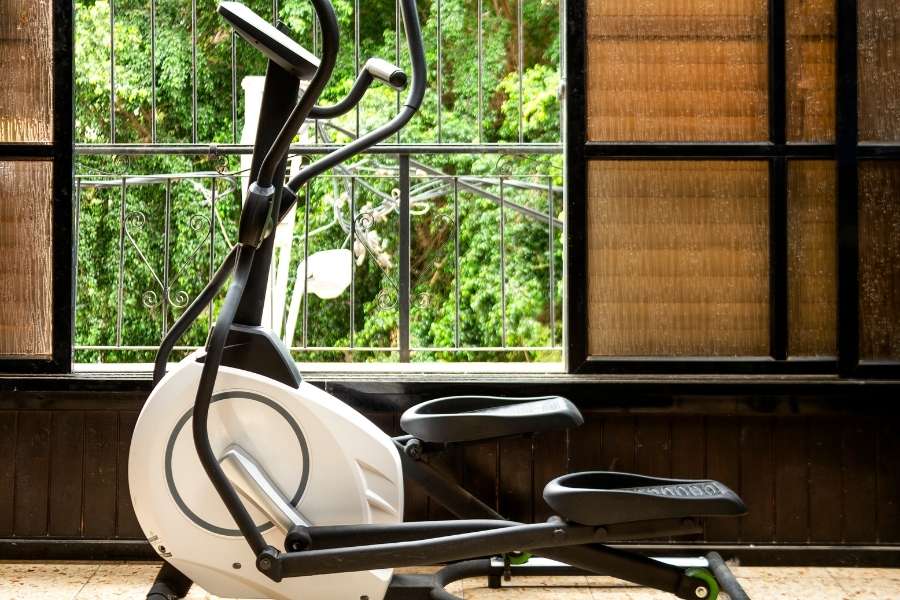 Elliptical trainer in front of the window