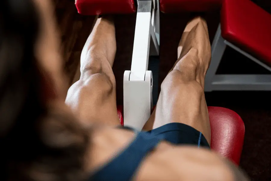 Image of a man doing leg extensions