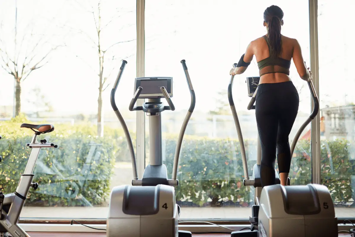 Image of a fit woman on an elliptical trainer